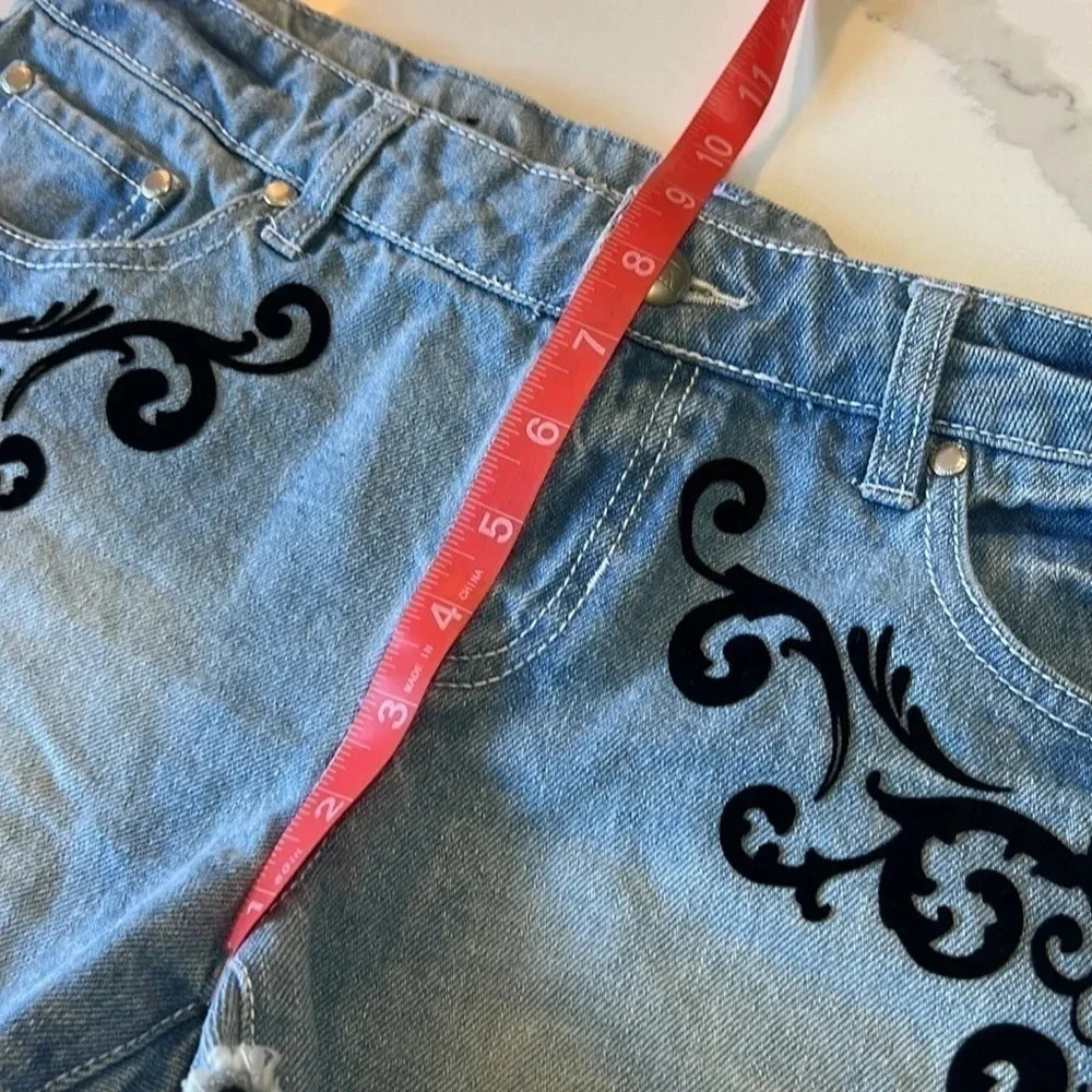 Material Girl light wash jean shorts with black velvet embellishments. Size 7 - Picture 8 of 9